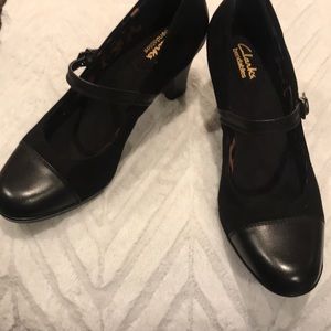 Brand new Clarks black pumps with buckle strap